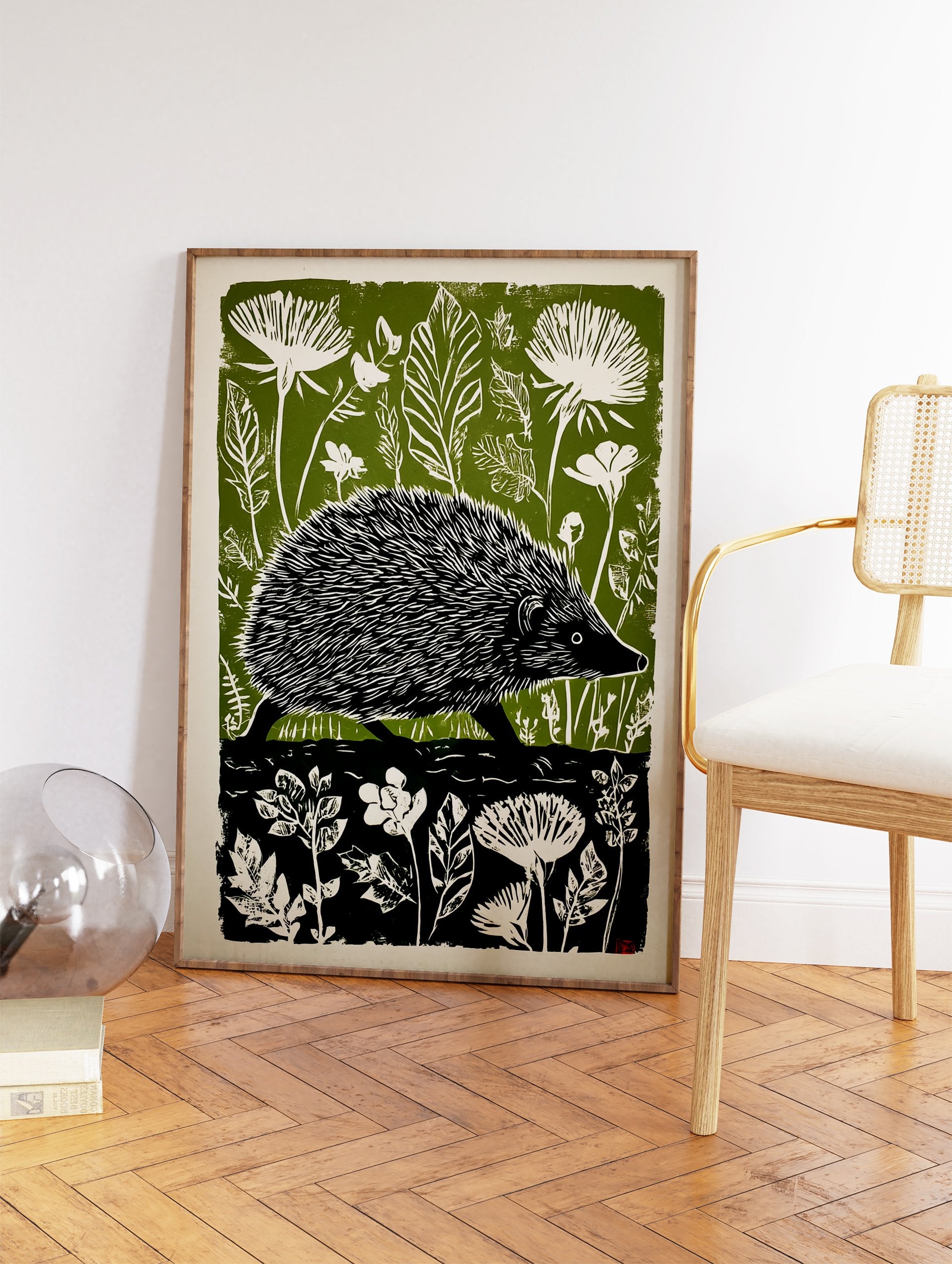 Green and white linocut print of a hedgehog walking through a forest with large leaves and flowers. - Image 2