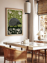 Green and white linocut print of a hedgehog walking through a forest with large leaves and flowers. - Image 3