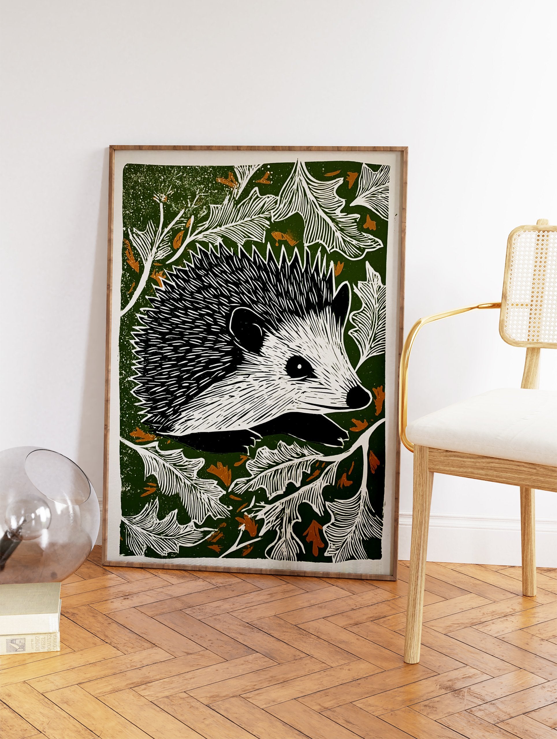 Hedgehog linocut print with black and white hedgehog surrounded by white leaves on a dark green background with brown accents. - Image 2
