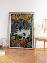 Hedgehog wall art print with black and white hedgehog, brown oak leaves, and white swirling patterns on a dark green background. - Image 2