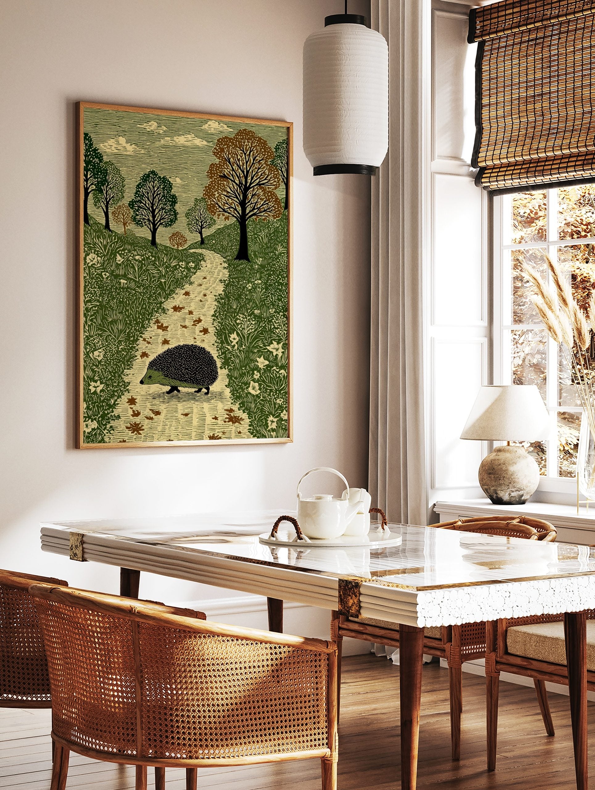 Illustrative print of a hedgehog walking on a path in a green woodland with trees and clouds, in a styled room mockup