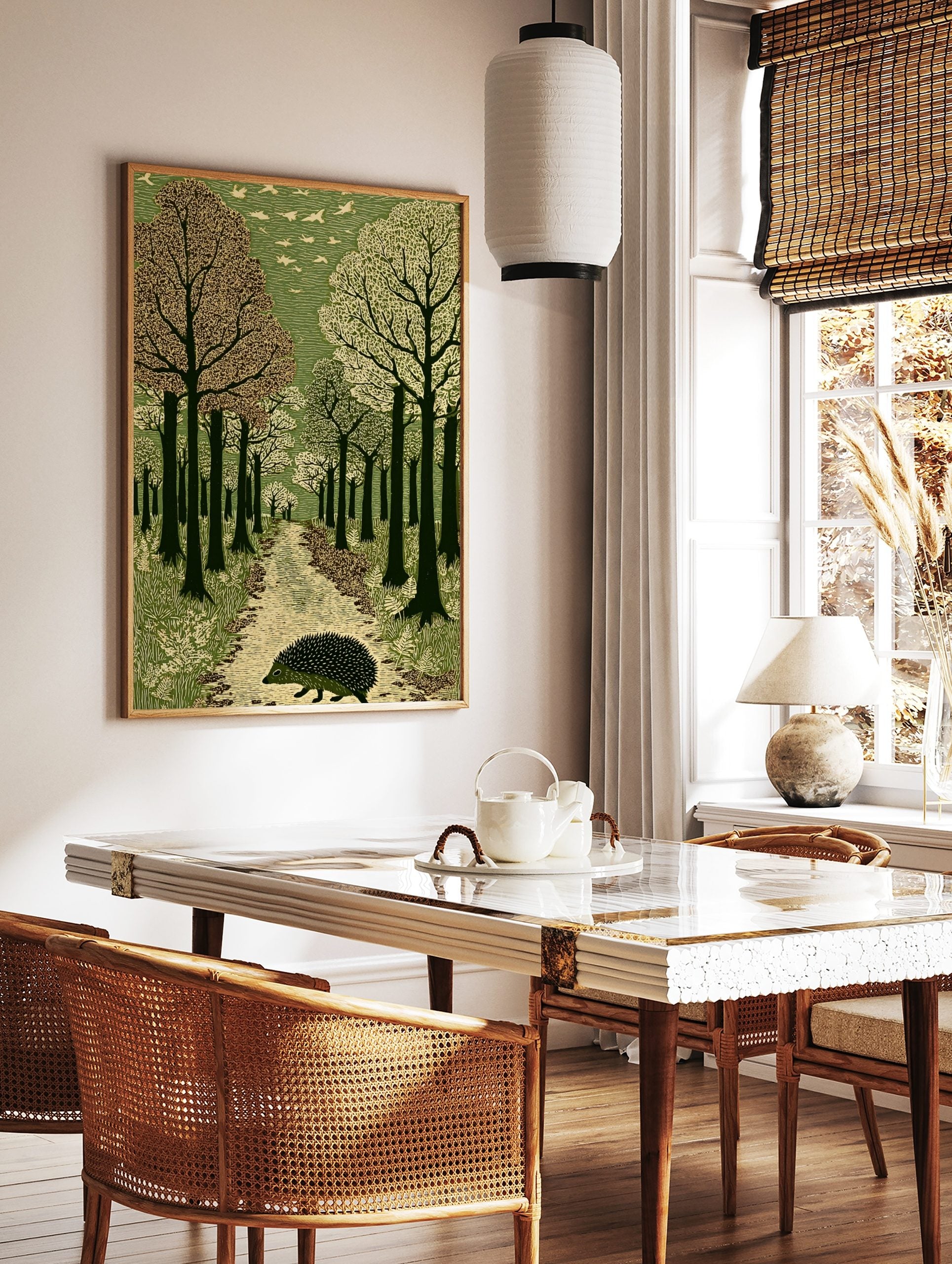 Hedgehog walking on a textured path through a green forest with flying birds, in a linocut art style, in a styled room mockup