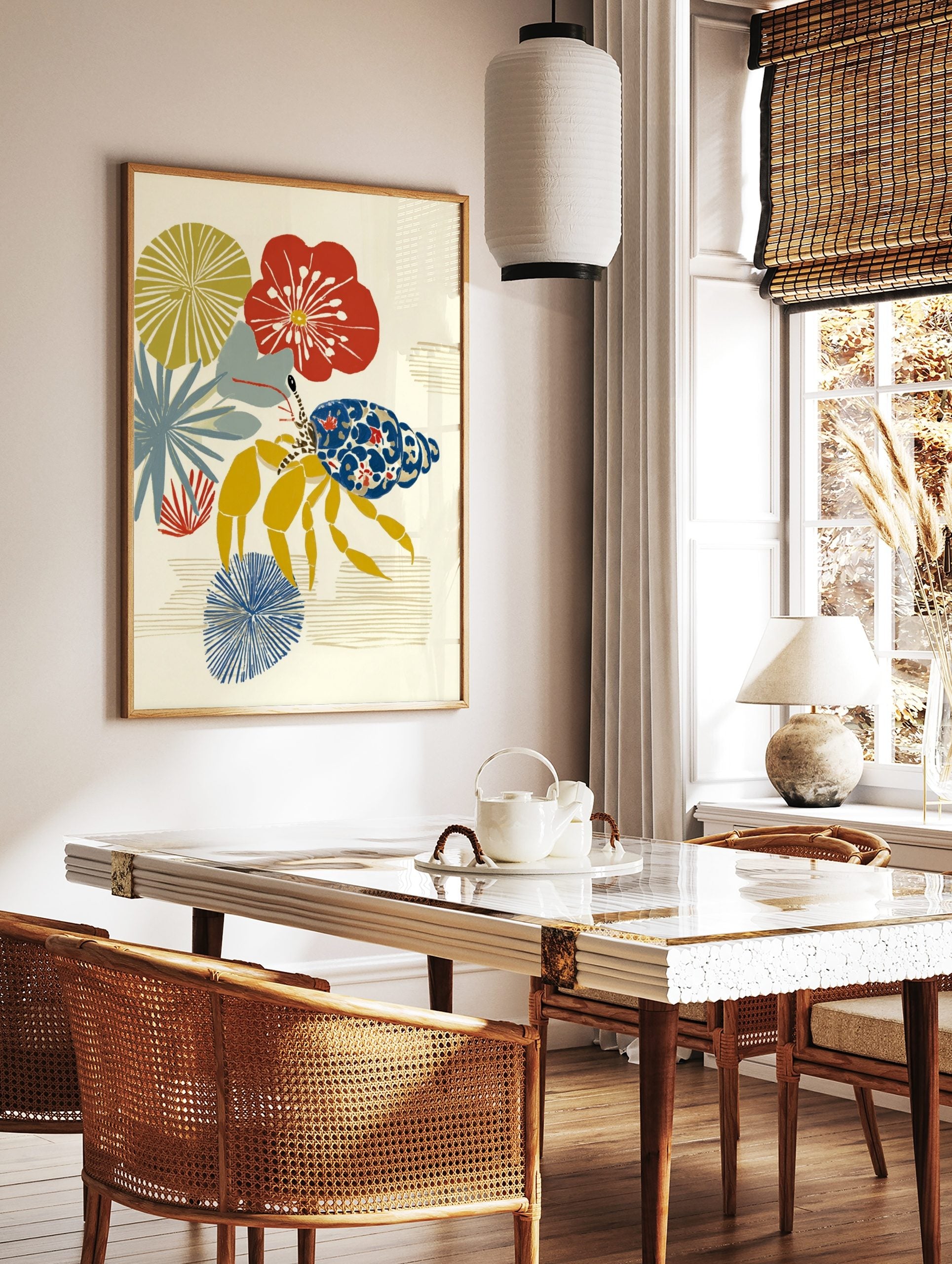 Illustrative hermit crab with blue and red patterned shell, yellow legs, and stylised red, yellow, in a styled room mockup