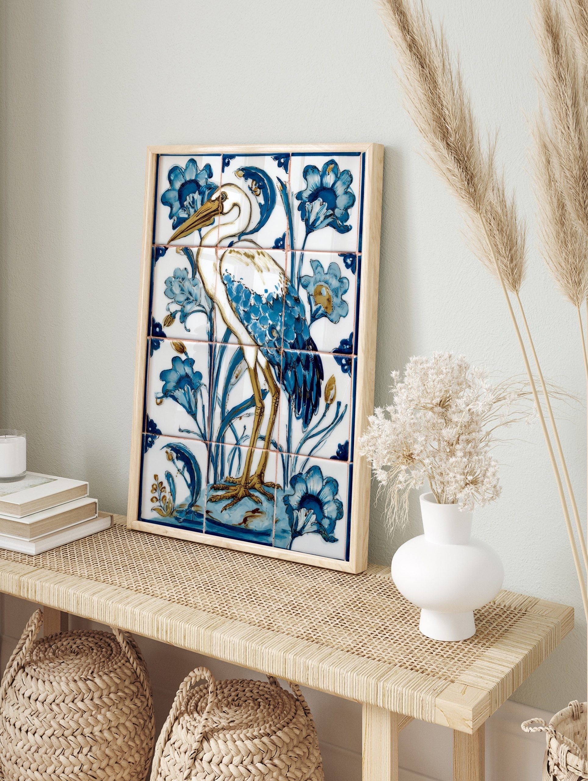 Illustrative white heron bird with blue feathers and golden legs, surrounded by blue flowers, in an alternate framed mockup