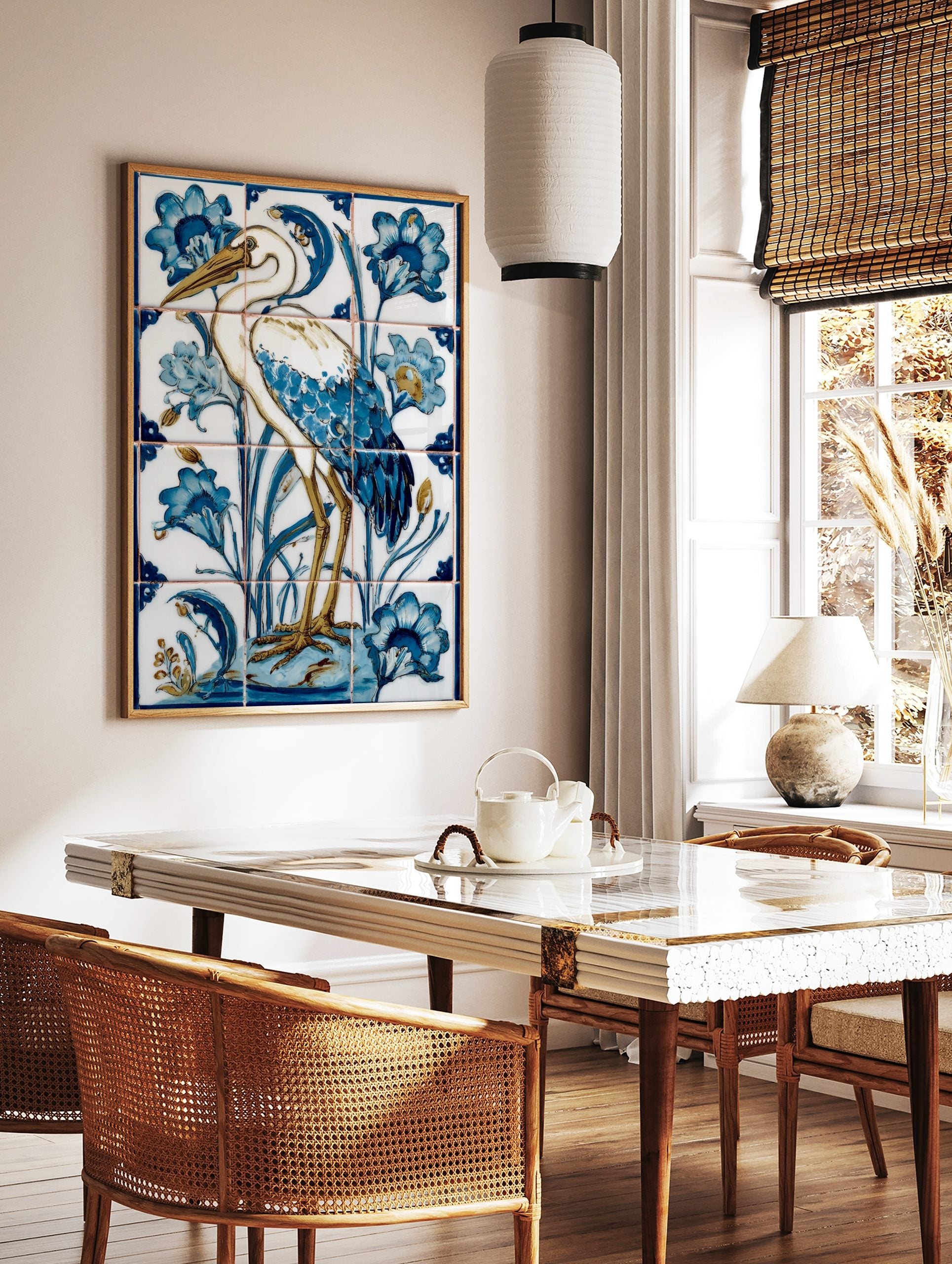 Illustrative white heron bird with blue feathers and golden legs, surrounded by blue flowers and, in a styled room mockup