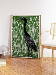 Green and black linocut print featuring a heron bird standing in tall marsh grasses, nature wall art. - Image 2