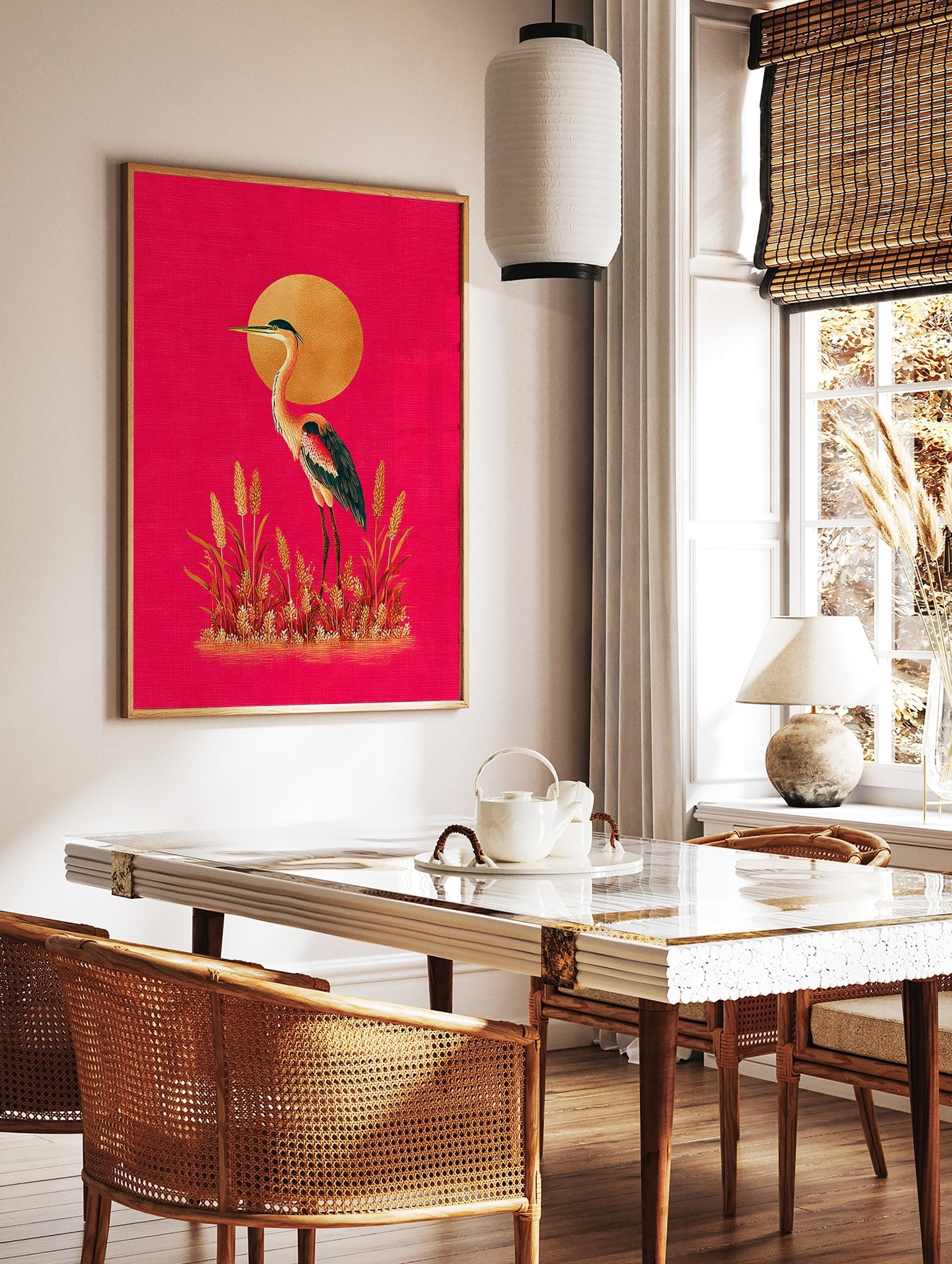 Illustrative heron or crane bird with golden sun and grasses on a hot pink background, portrait, in a styled room mockup