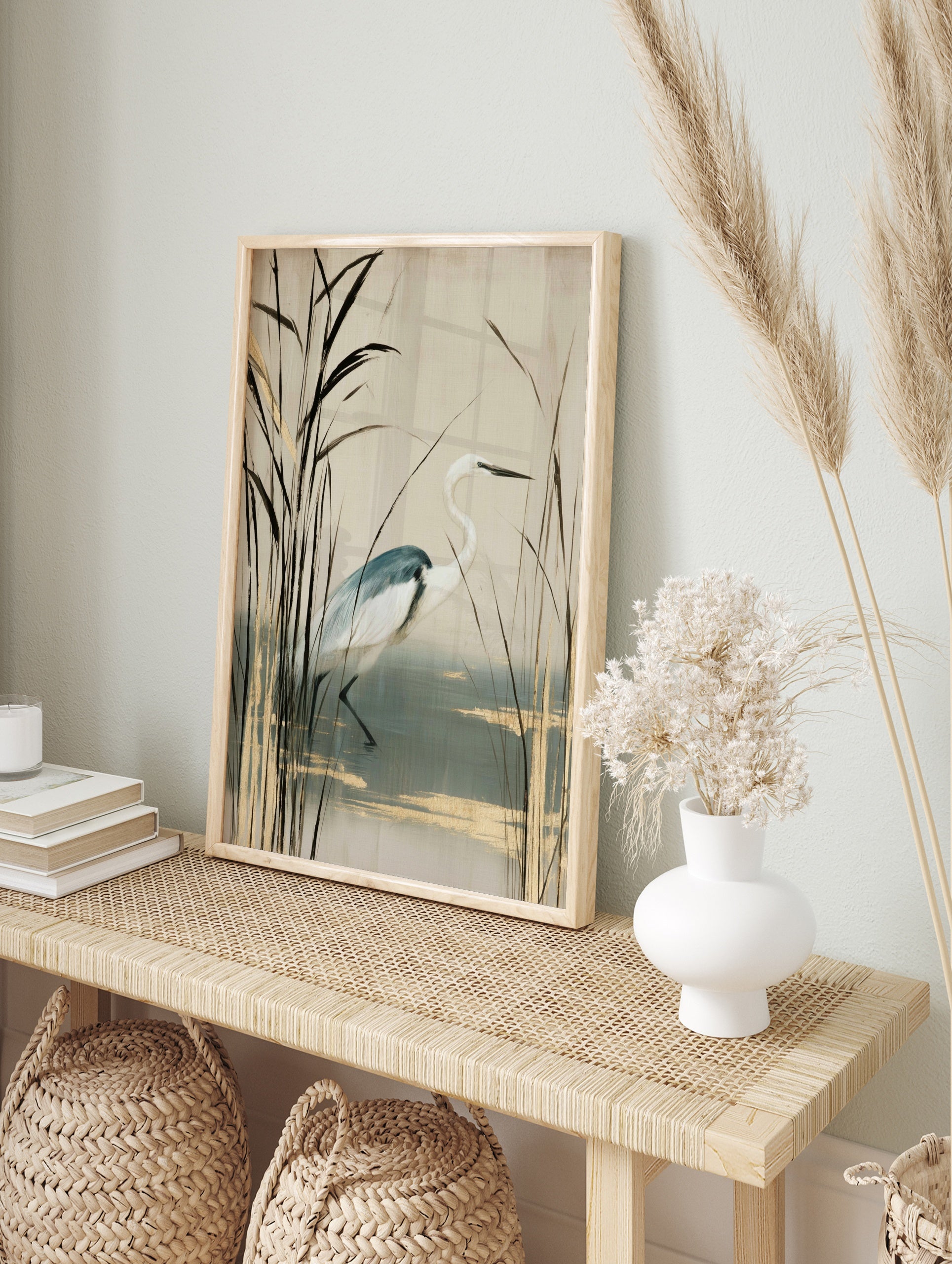 White heron bird standing among tall reeds with gold accents on a cream background, in an alternate framed mockup