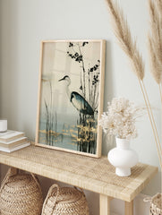 Heron bird standing in marsh reeds with gold leaf accents, neutral background wall art print, in an alternate framed mockup