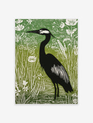 Illustrative green and black heron print standing in water amongst white botanical plants and reeds