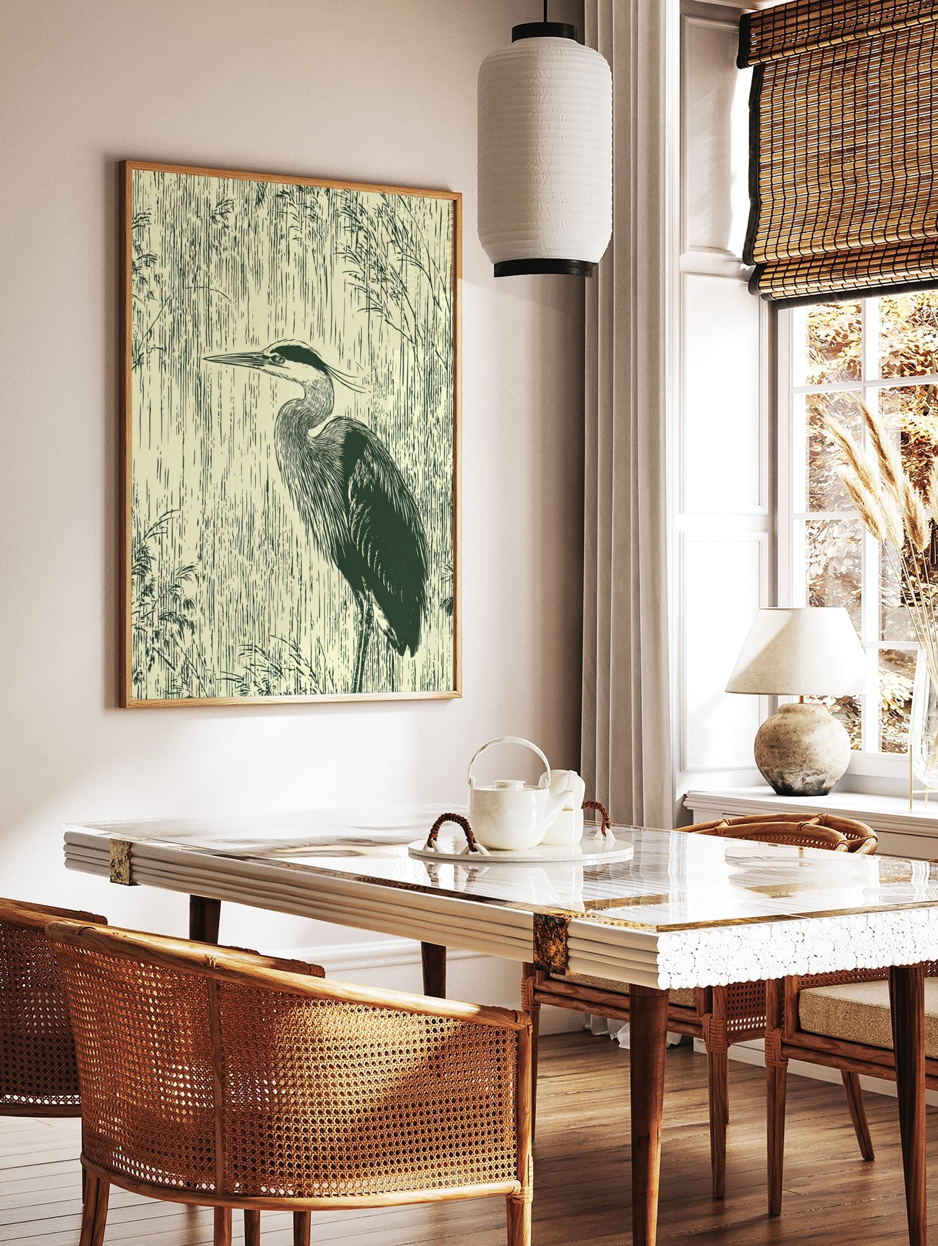 Illustrative dark green heron in profile against vertical cream reeds wall art print, in a styled room mockup