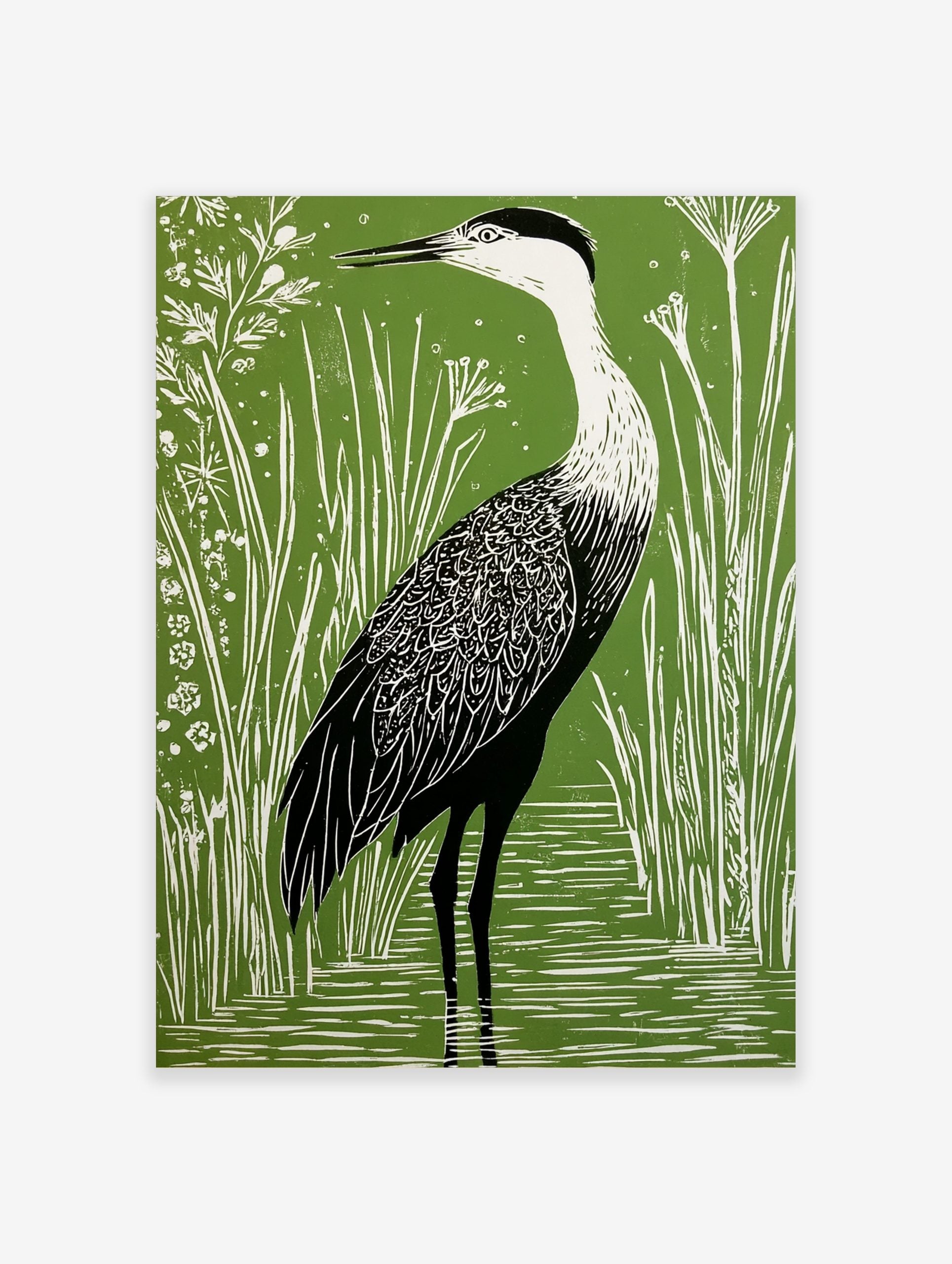 Green and white linocut style art print of a heron wading in water among tall reeds and small flowers