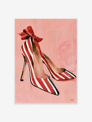 Illustrative print of red and white striped high heel shoes with a large red bow on a soft pink background