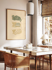 Three stylised Highland cows in green and gold, with leafy and plaid patterns, on a beige background, in a styled room mockup