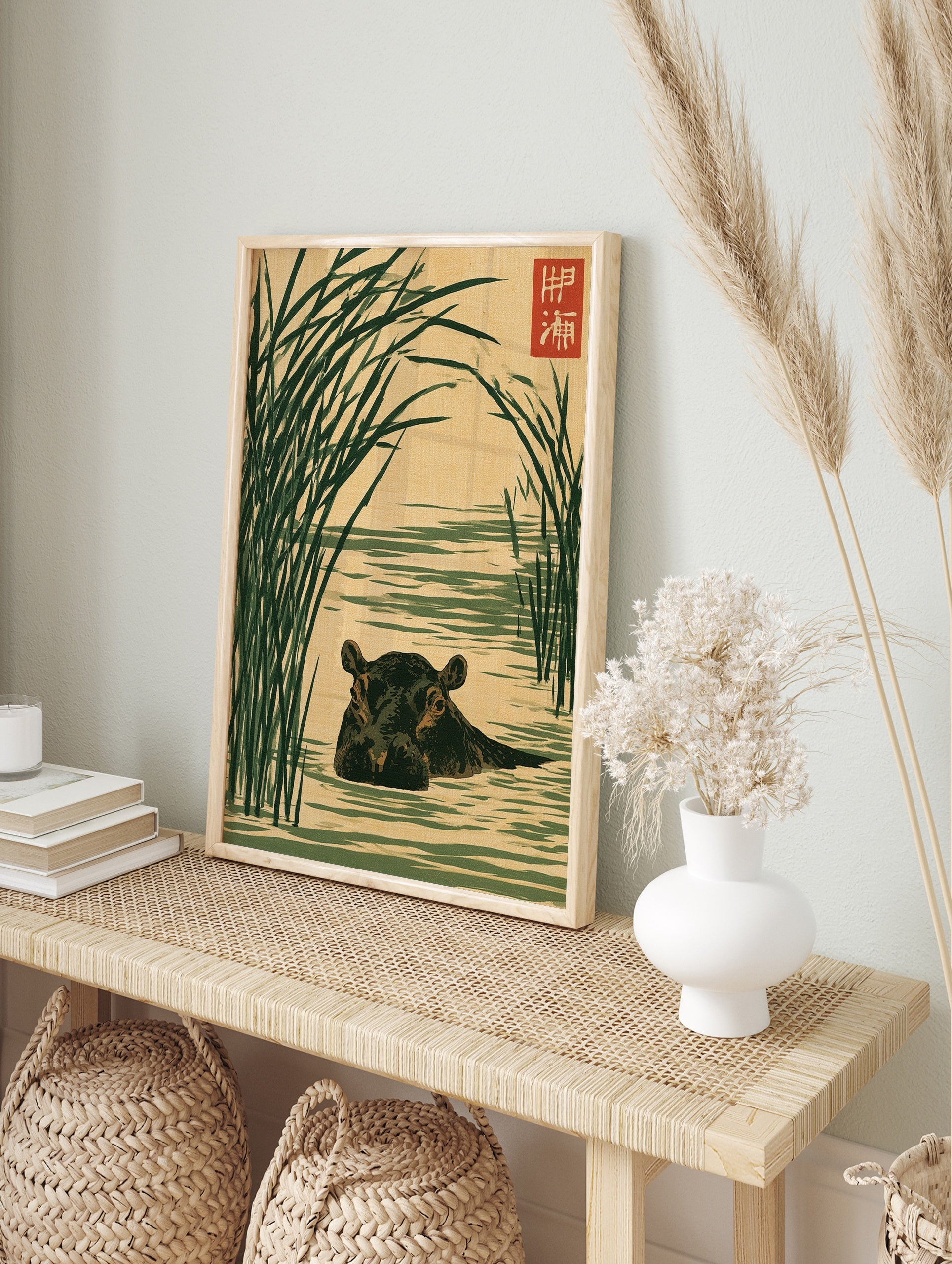 Japanese-style illustration of a hippo in water surrounded by tall green reeds on a tan, in an alternate framed mockup