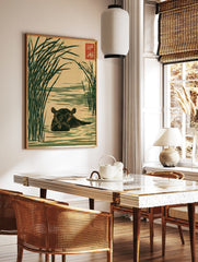 Japanese-style illustration of a hippo in water surrounded by tall green reeds on a tan background, in a styled room mockup
