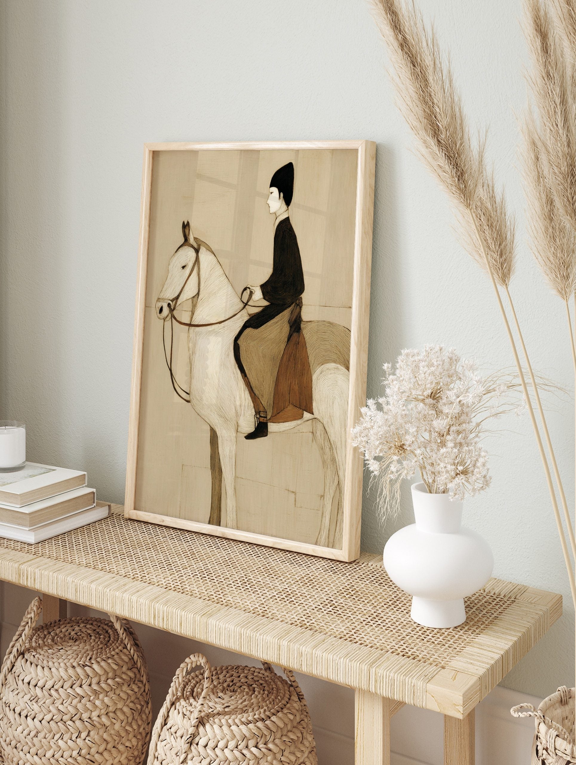 Illustrative sepia print of a horse and rider in profile, with fine linear textures and, in an alternate framed mockup