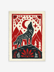 Howling wolf against red moon and stars, framed by mountains and folk art border in red, black, cream