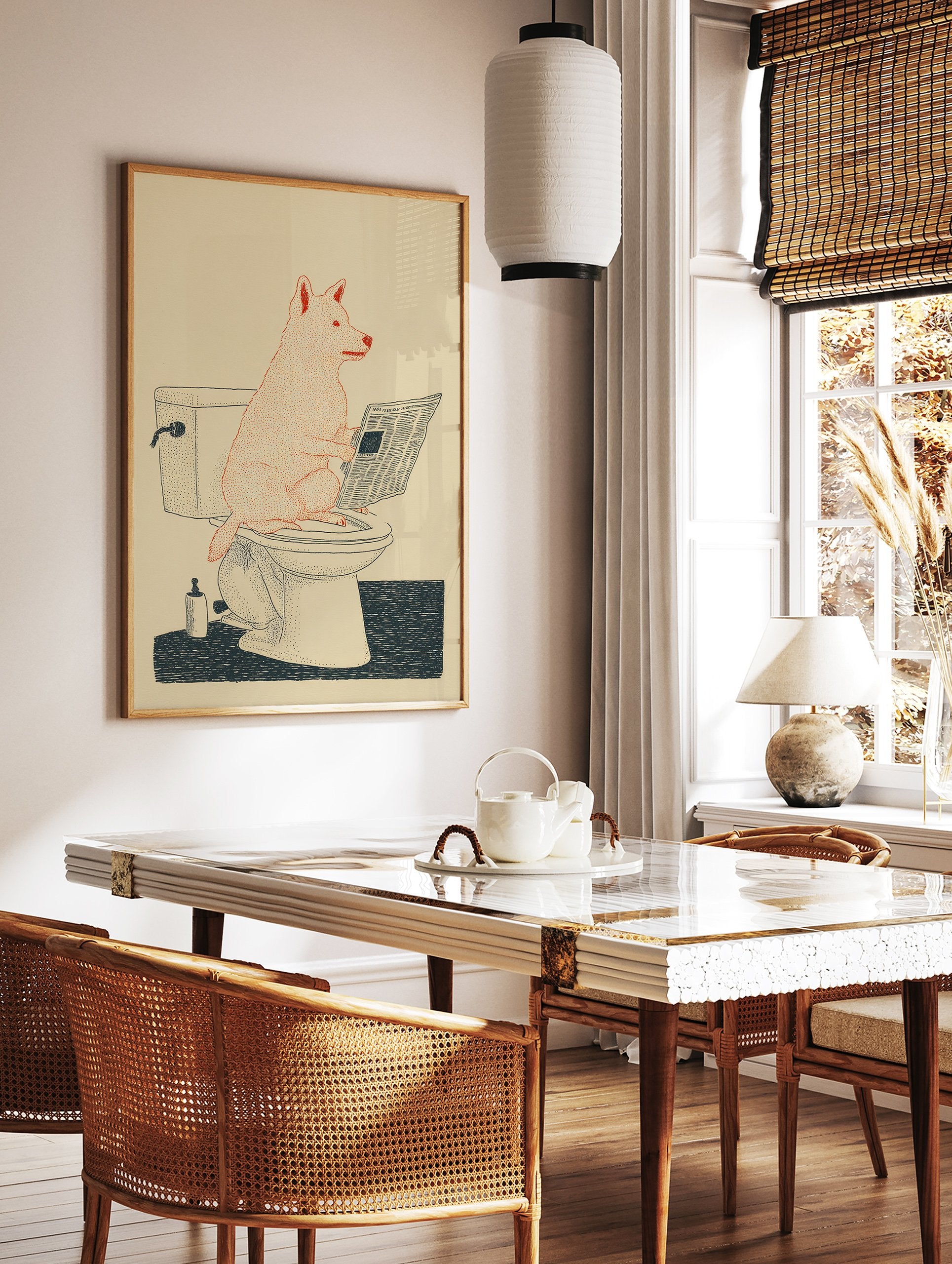 Illustrated humorous dog wall art showing a red dog sitting on a toilet reading a newspaper on a cream background. - Image 2