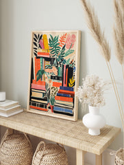 Illustrated poster showing stacks of books in orange, green, black, yellow, pink with various green and orange plants. - Image 4