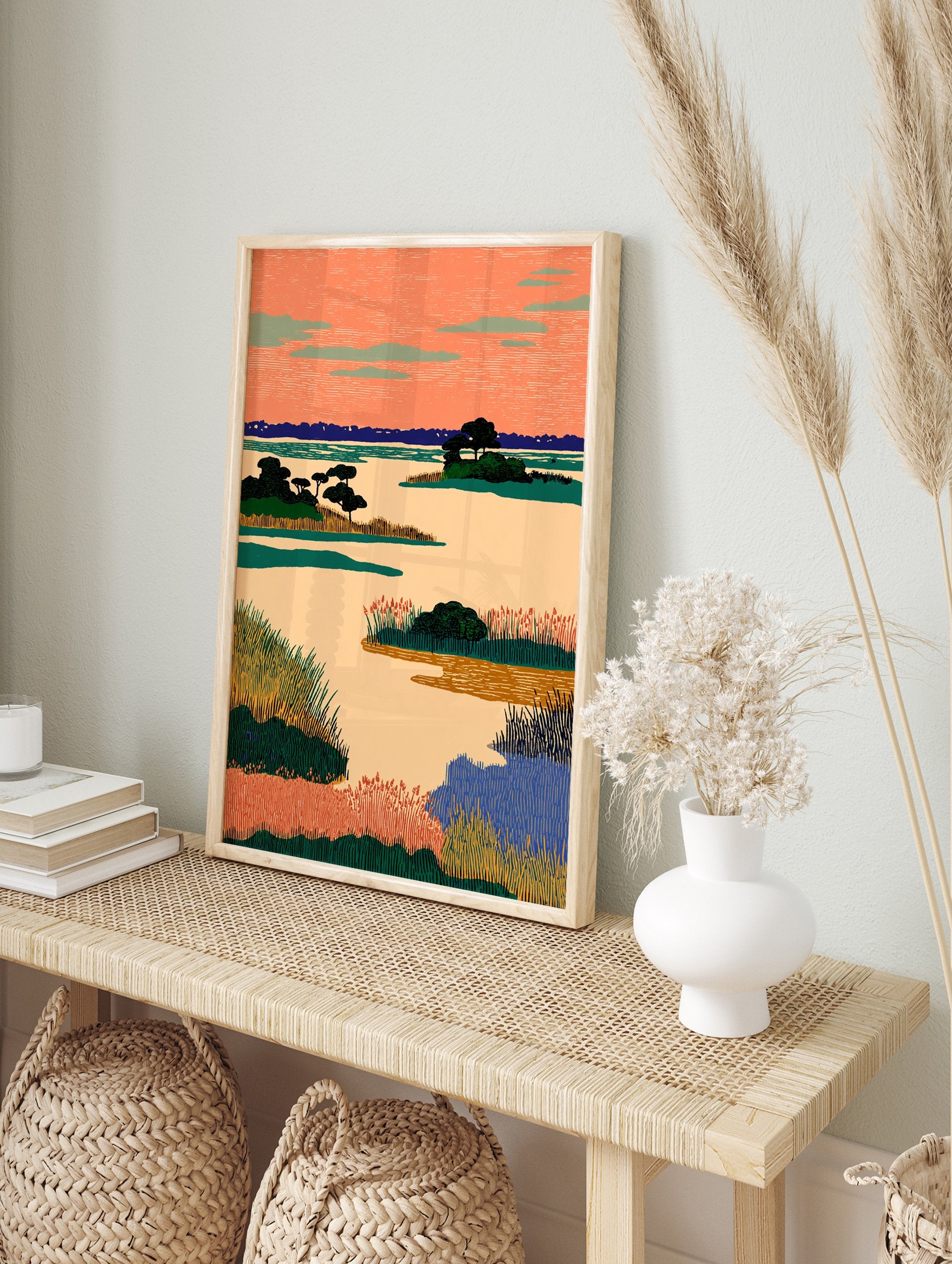 Illustrative landscape wall art depicting a marshland with an orange sky, green plants, and blue water in a stylized art print. - Image 3