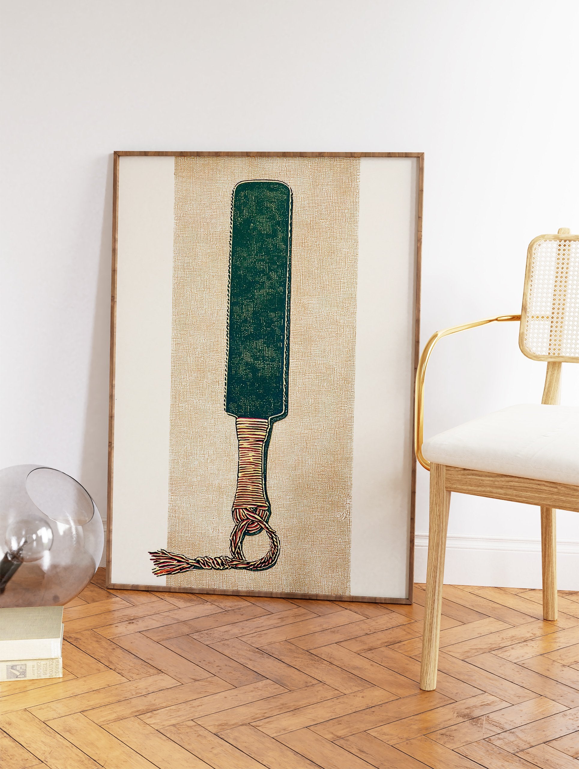 Illustrative paddle wall art print with a green blade, wrapped handle, and knotted tassel on a textured tan background. - Image 2
