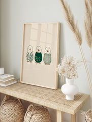 Illustrative penguin wall art featuring botanical leaves, white florals, and a plaid pattern, in an alternate framed mockup
