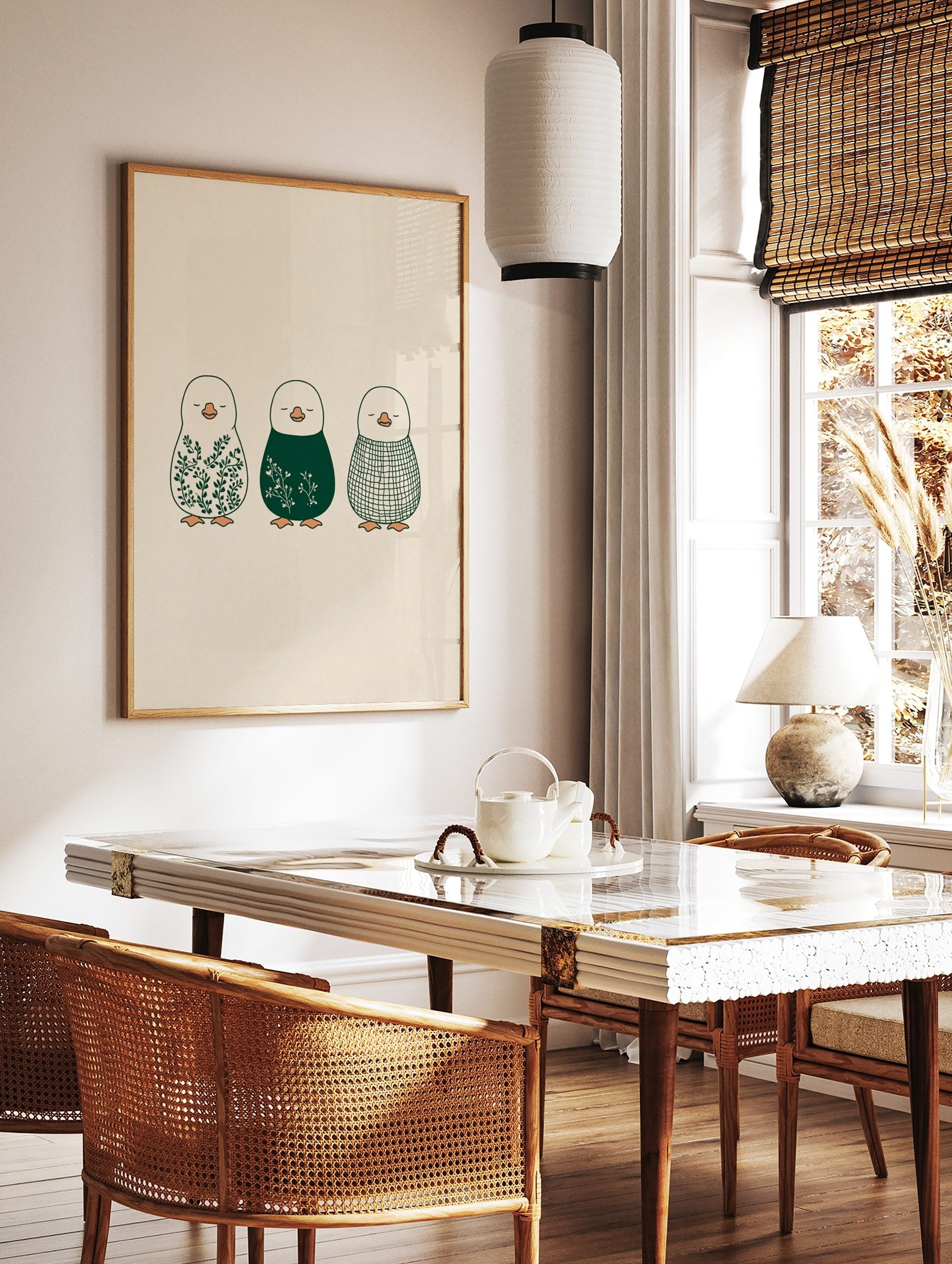 Illustrative penguin wall art featuring botanical leaves, white florals, and a plaid pattern in, in a styled room mockup