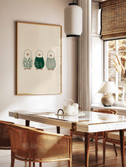 Illustrative penguin wall art featuring botanical leaves, white florals, and a plaid pattern in, in a styled room mockup