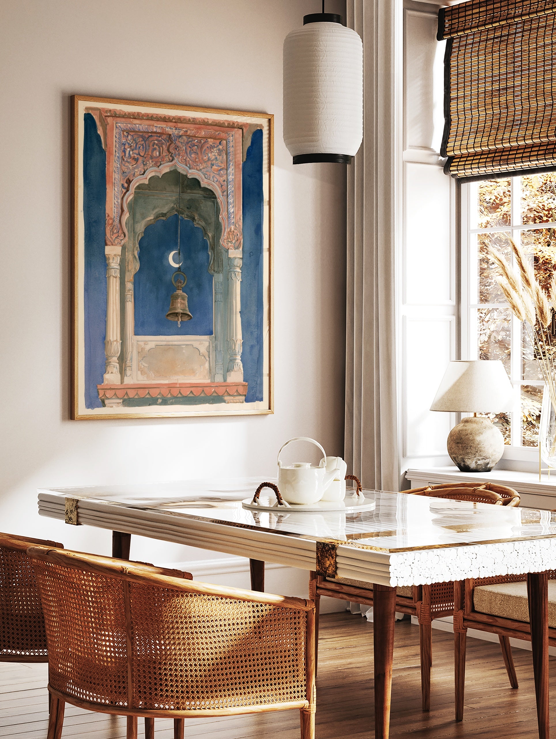 Ornate Indian architectural archway with a hanging brass bell and crescent moon against a deep blue, in a styled room mockup