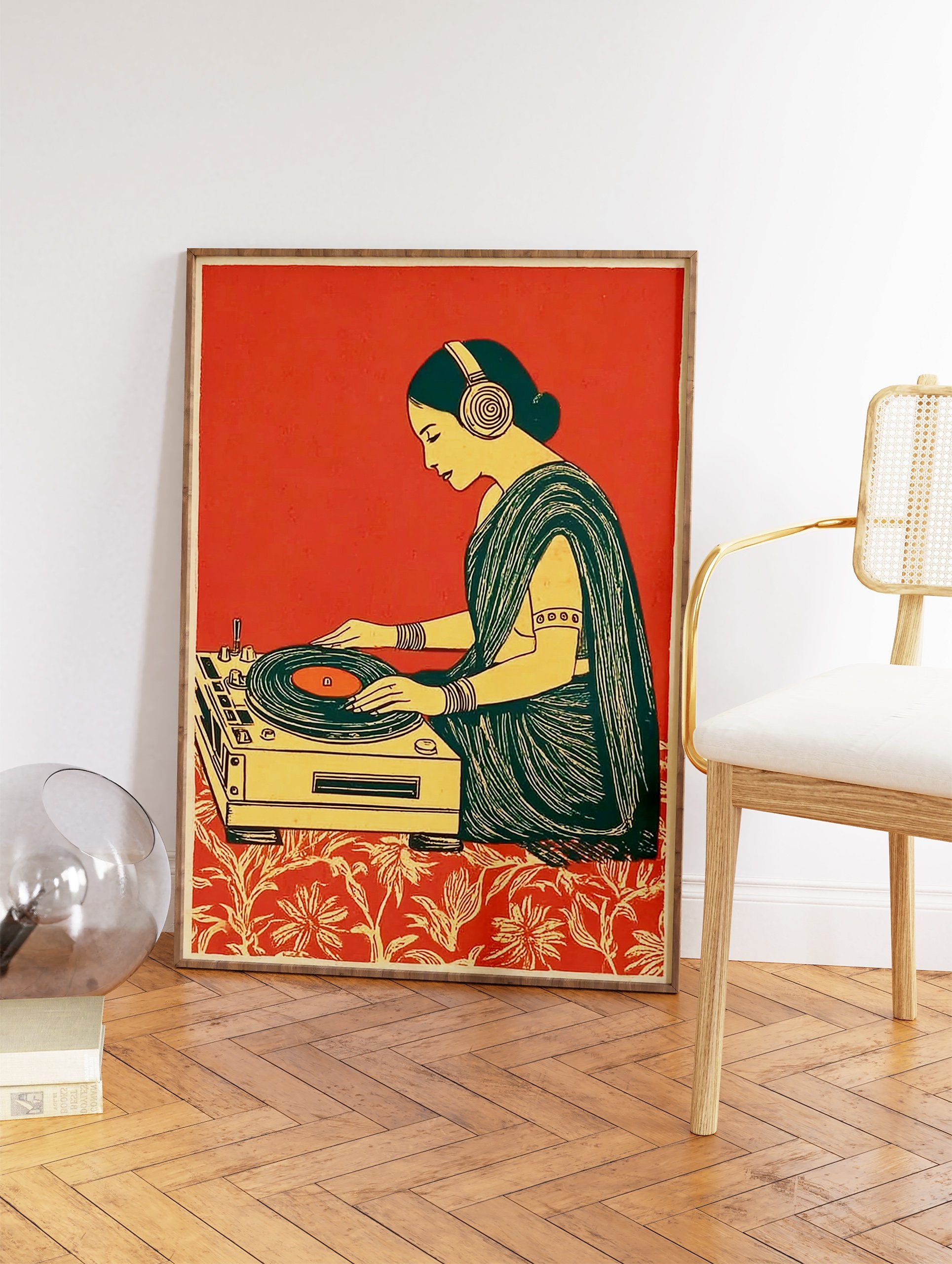 Illustrative art print of an Indian woman wearing headphones, DJing on a turntable, with a red background and patterned floor. - Image 2