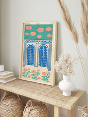 Indian Wall Art print with blue arched doors, red floral patterns, and teal sky on a cream background, folk art style. - Image 3