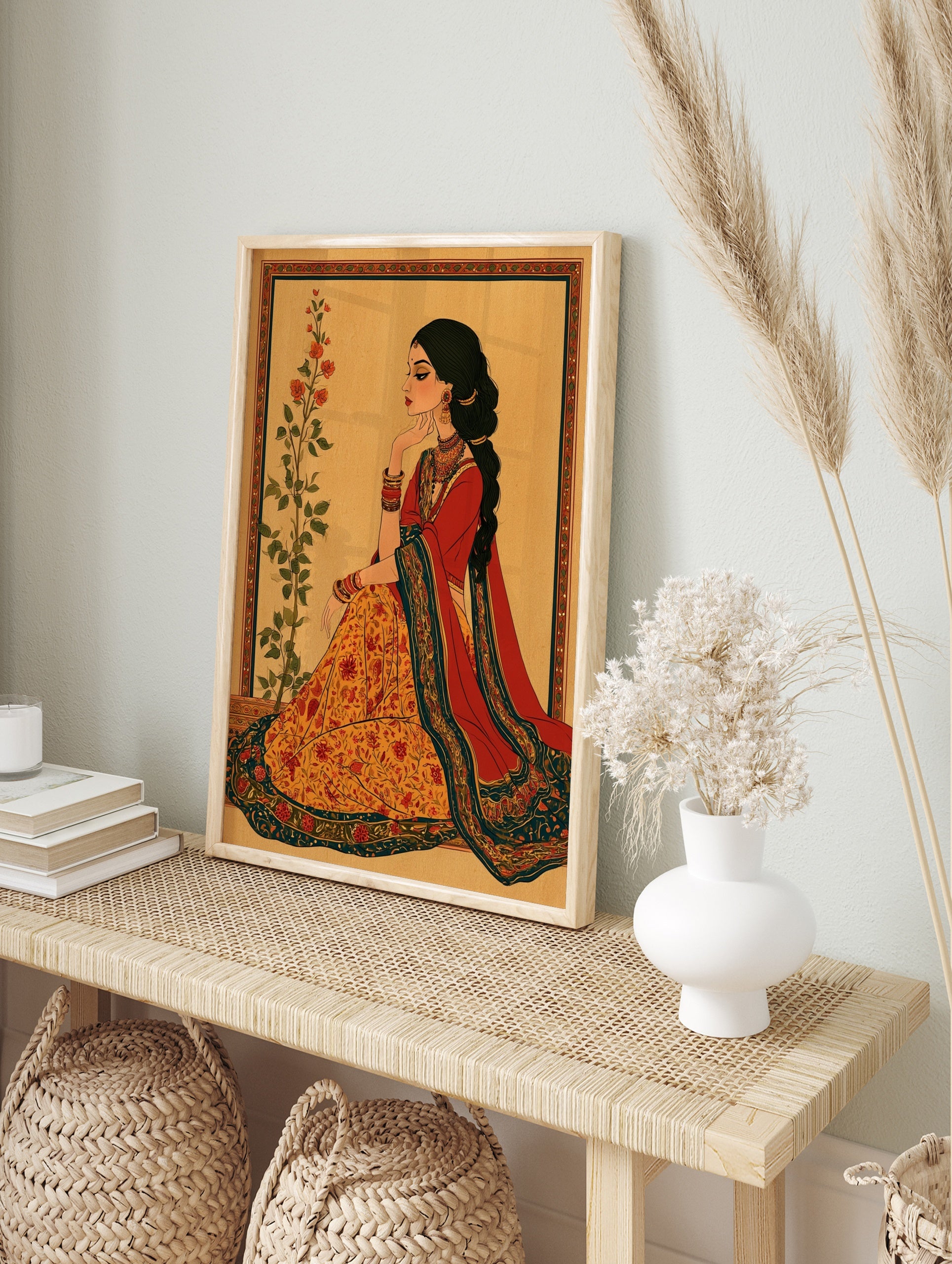 Illustrative Indian woman wall art in red and orange attire with floral botanical elements, in an alternate framed mockup