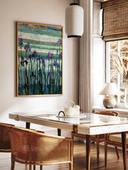 Purple iris flowers with green stems against a textured, multi-coloured striped background in an, in a styled room mockup