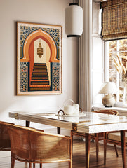 Illustrative print of a Moorish arched doorway with a hanging lantern and geometric tile patterns, in a styled room mockup