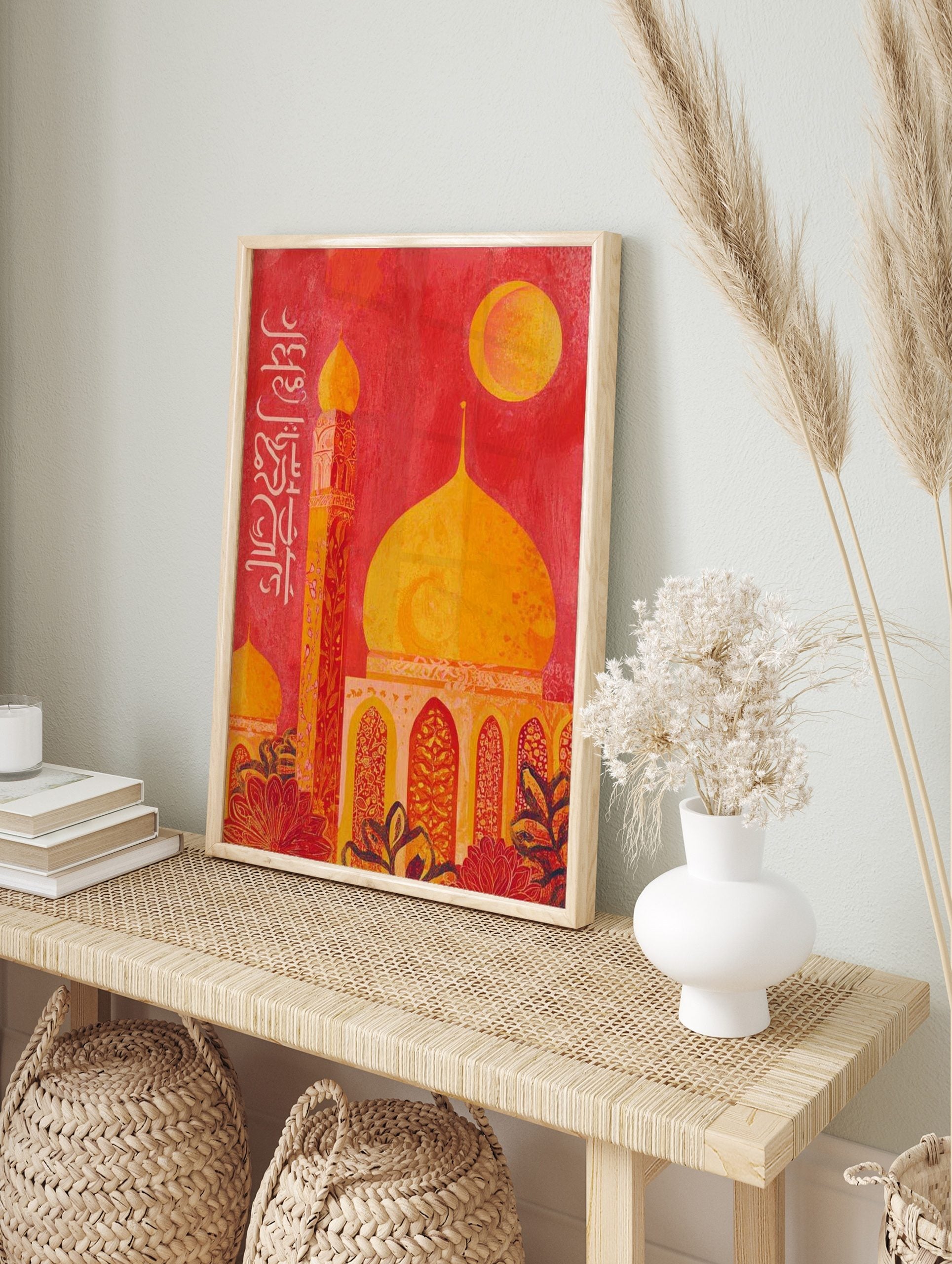 Islamic mosque wall art with golden dome, tall minaret, moon, and white Arabic calligraphy on, in an alternate framed mockup