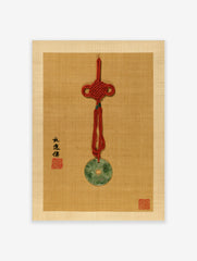 Jade bi pendant with red knot and calligraphy on tan textured background