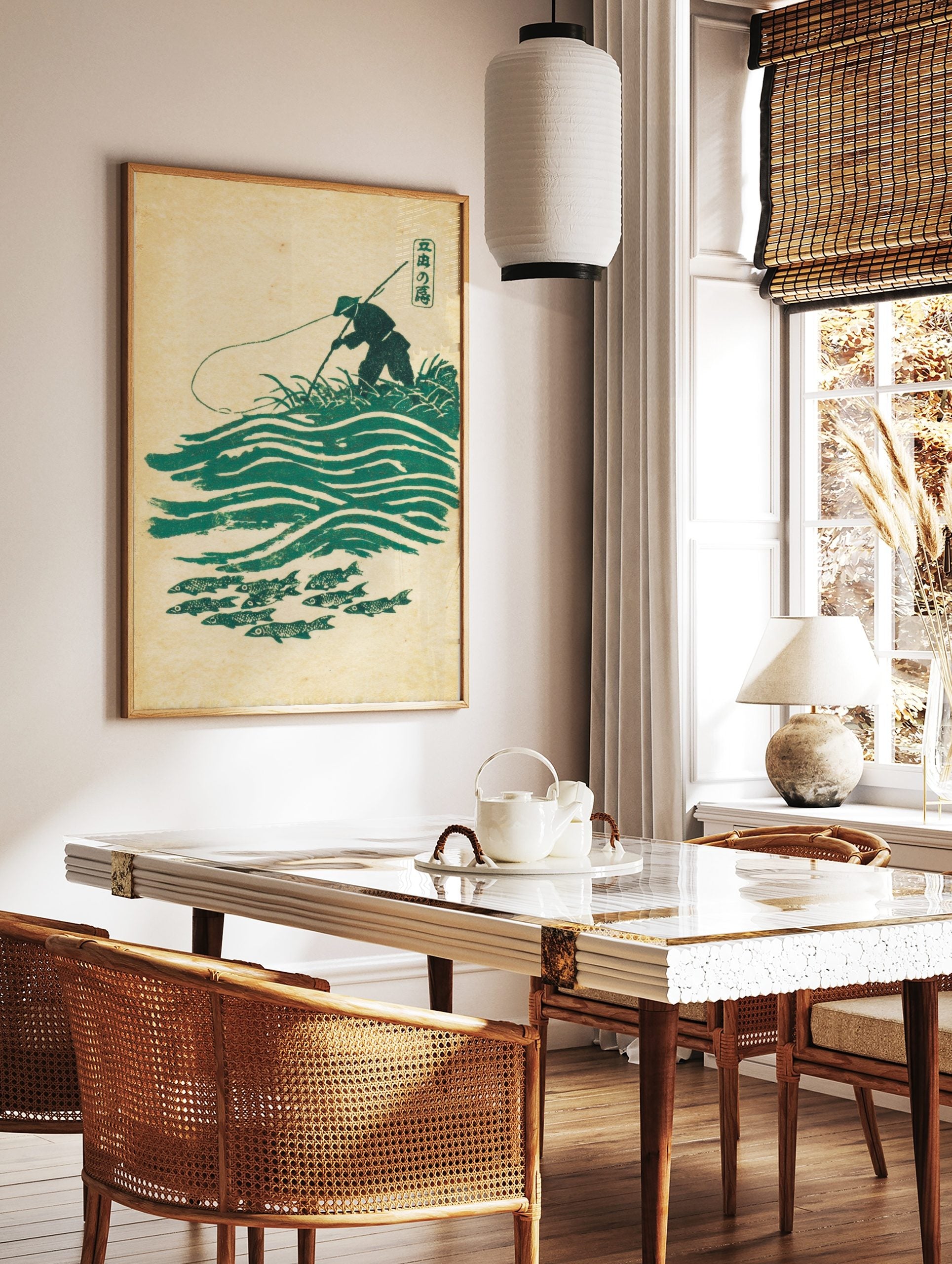 Japanese angler in conical hat fishing over green waves and school of fish in woodblock print style, in a styled room mockup