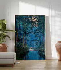 Japanese bamboo forest wall art with a blue river reflecting tall green trees and a small hut in the dense foliage. - Image 3