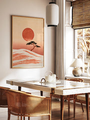 Minimalist Japanese landscape print featuring a bonsai tree on a sandy dune with a large red sun on, in a styled room mockup