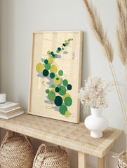 Japanese botanical art print with green and yellow pond flora, blue waves, and golden vine on, in an alternate framed mockup