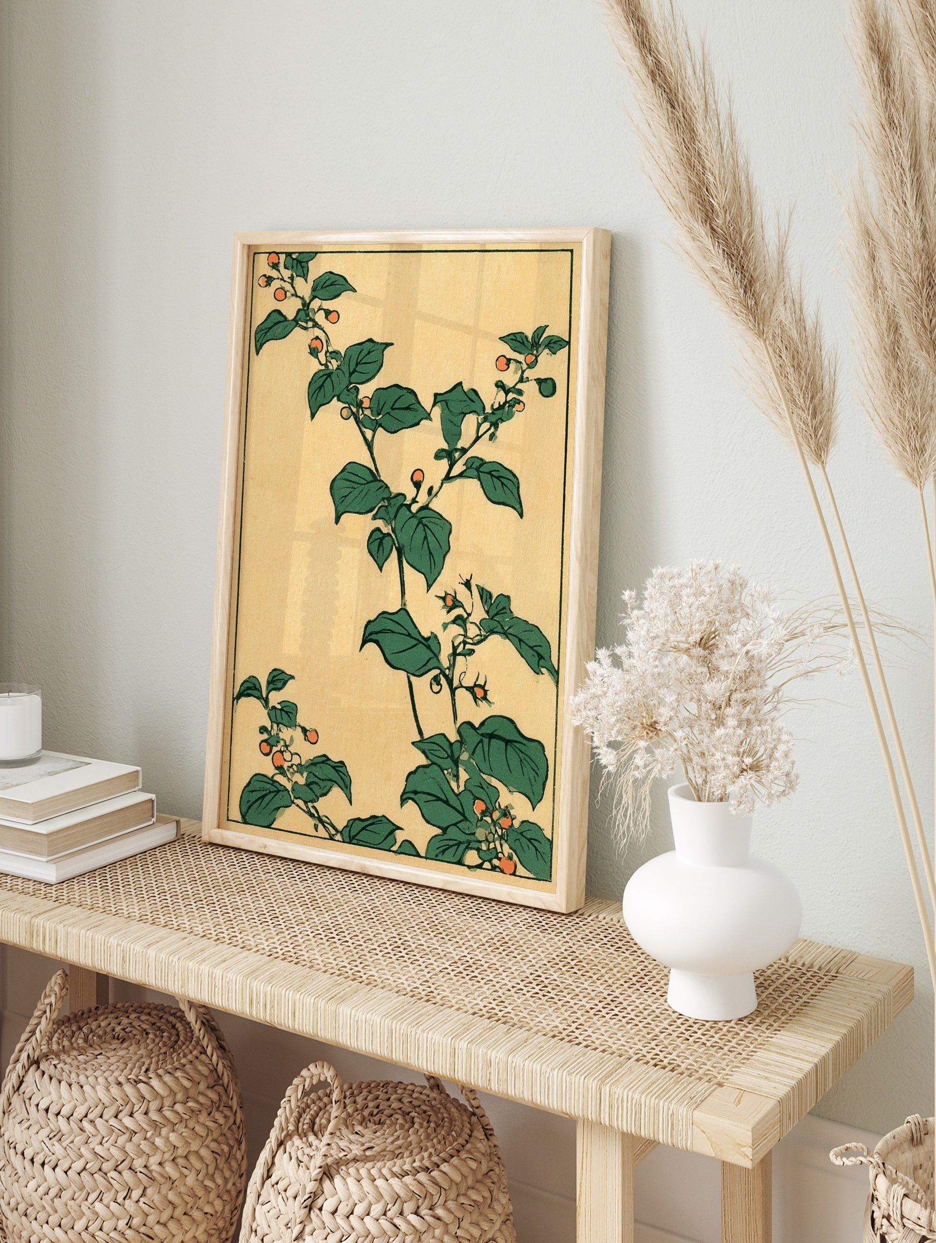 Japanese botanical art print featuring green leaves and orange berries on a tan background, in an alternate framed mockup