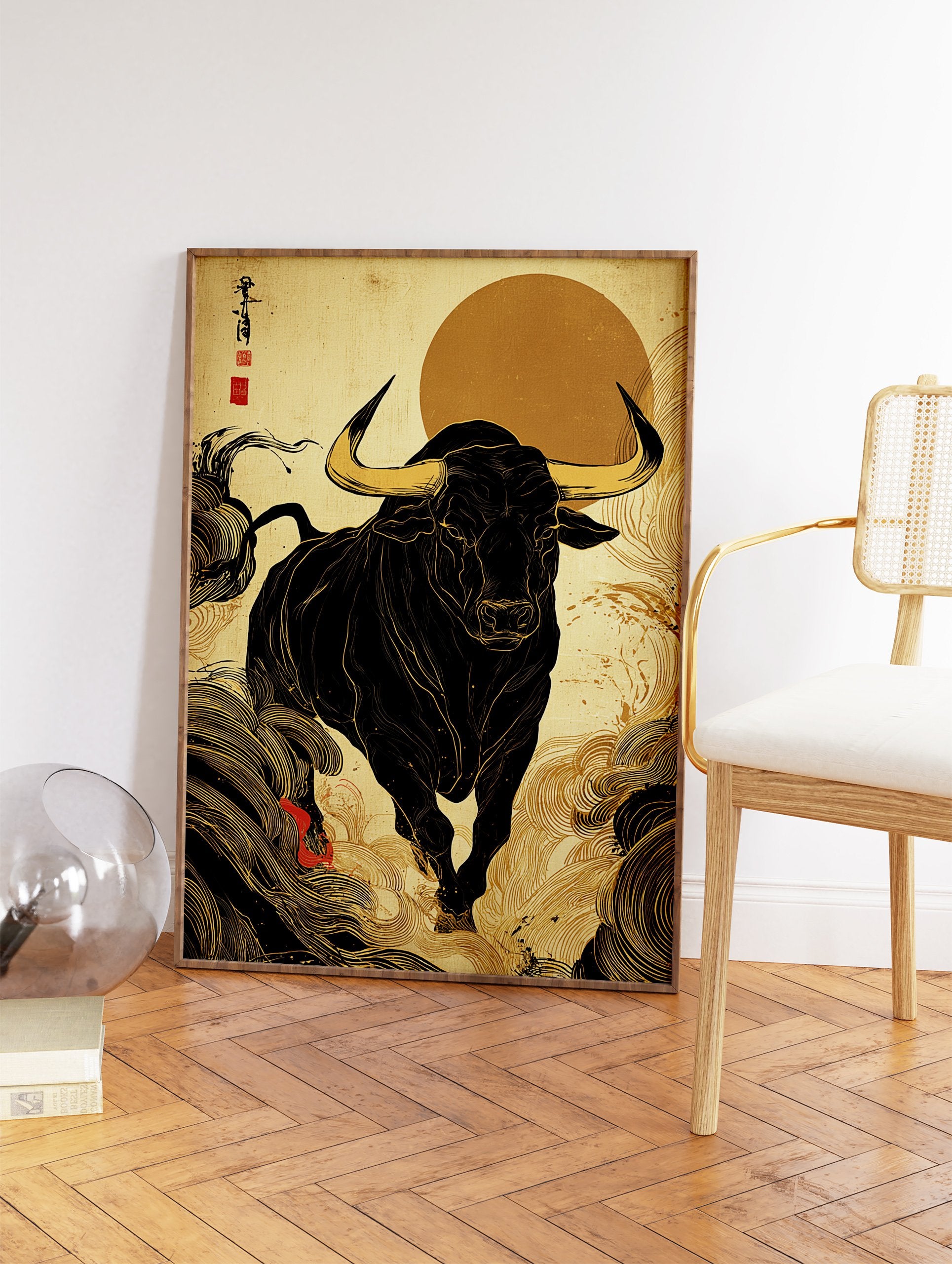 Japanese Bull Art Print with a black bull, golden horns, and swirling gold patterns on an ochre background with a red sun. - Image 2