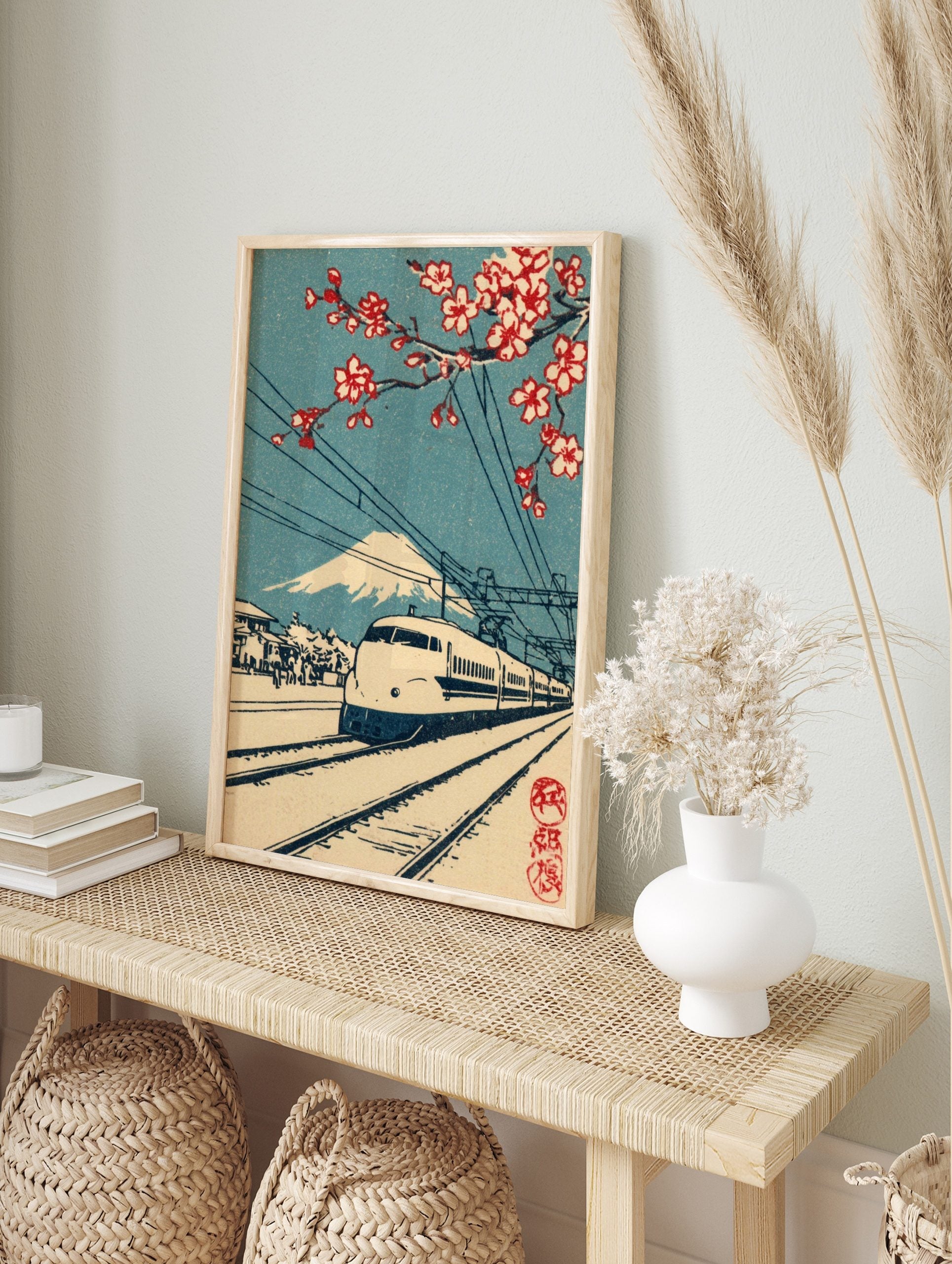 Japanese bullet train with Mount Fuji and red cherry blossoms, railway tracks, blue sky, in an alternate framed mockup