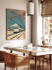 Japanese bullet train with Mount Fuji and red cherry blossoms, railway tracks, blue sky, woodblock, in a styled room mockup