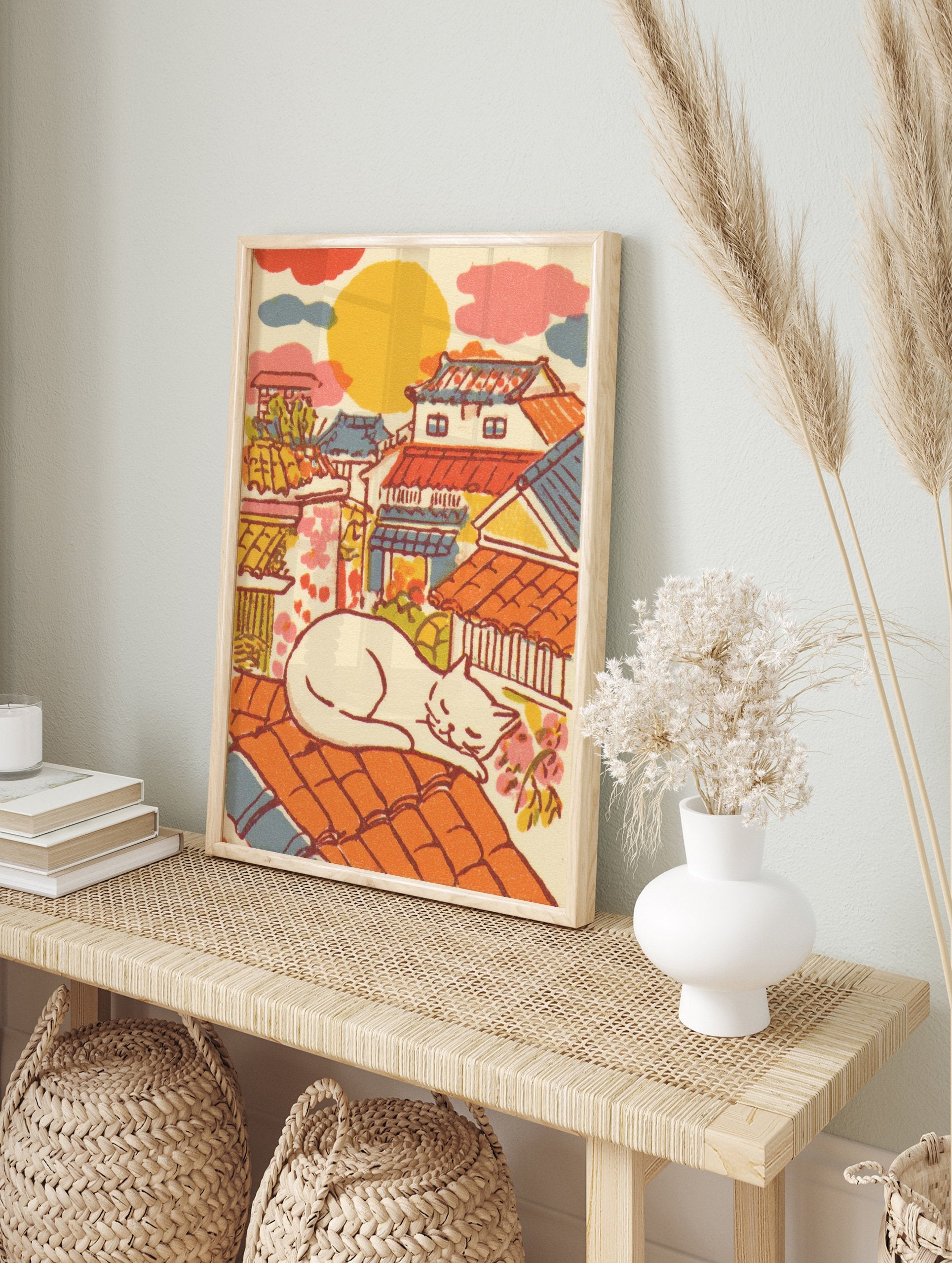 Illustrative Japanese Cat Art print of a white cat sleeping on an orange tiled roof overlooking a colorful traditional townscape. - Image 3