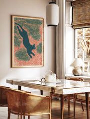 Japanese black cat art print in Ukiyo-e style, leaping through pine branches on a red textured background. - Image 2