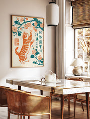 Japanese woodblock style art print of an orange tabby cat reaching for pink cherry blossoms on a teal branch. - Image 2