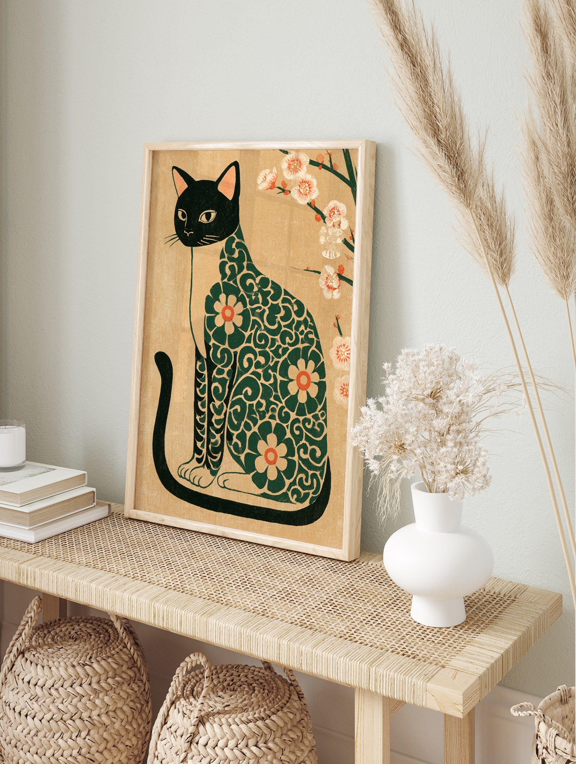 Japanese-style illustration of a black cat with a green floral pattern and white plum, in an alternate framed mockup