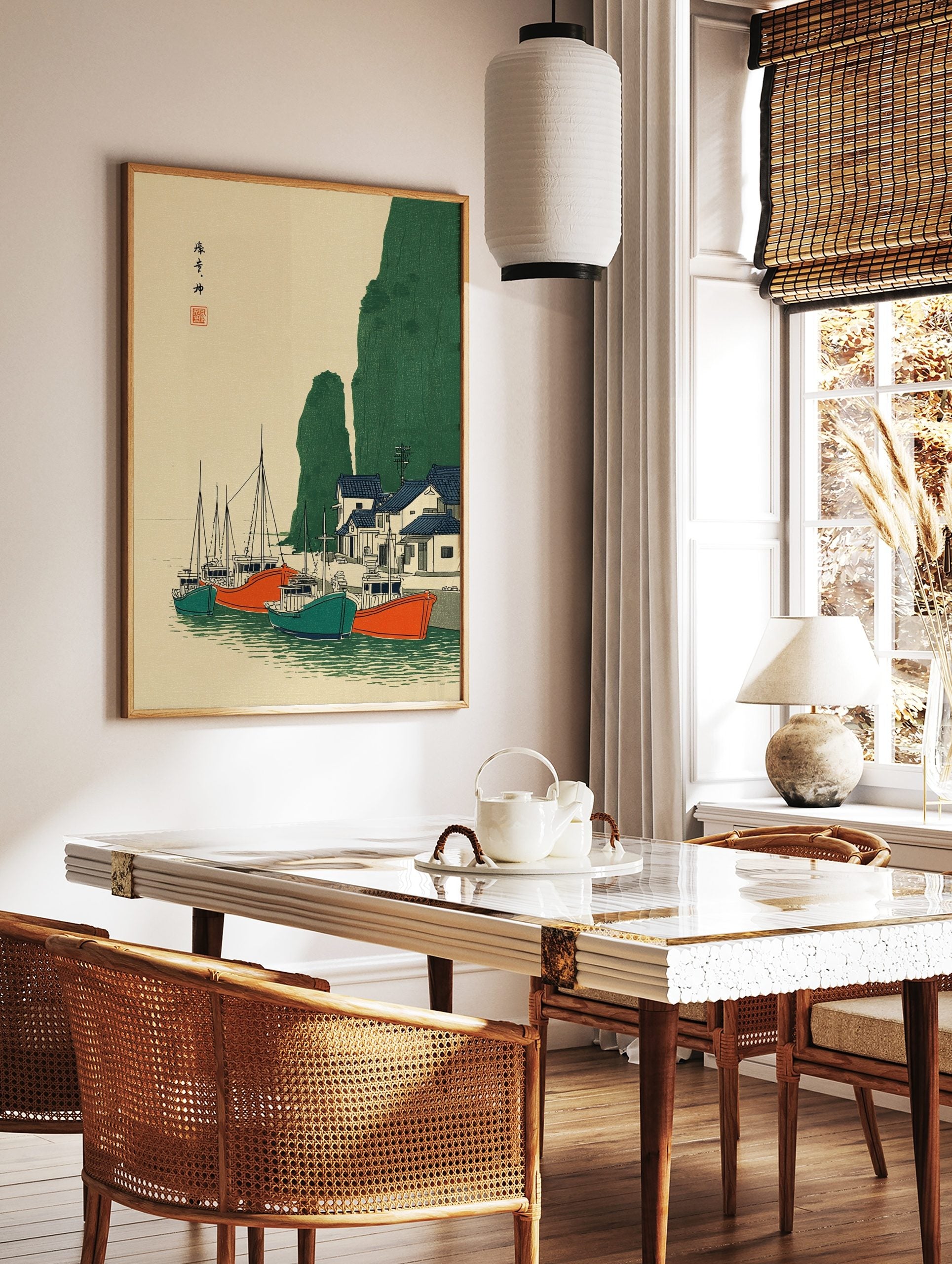 Japanese coastal village wall art with fishing boats, green cliffs, and blue-roofed houses in, in a styled room mockup